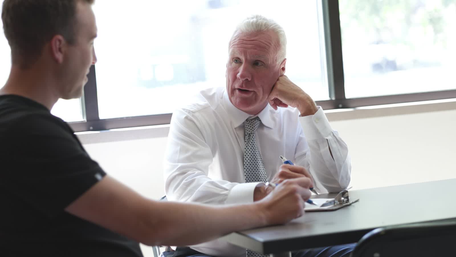 Succession Story, two dentists at a window table