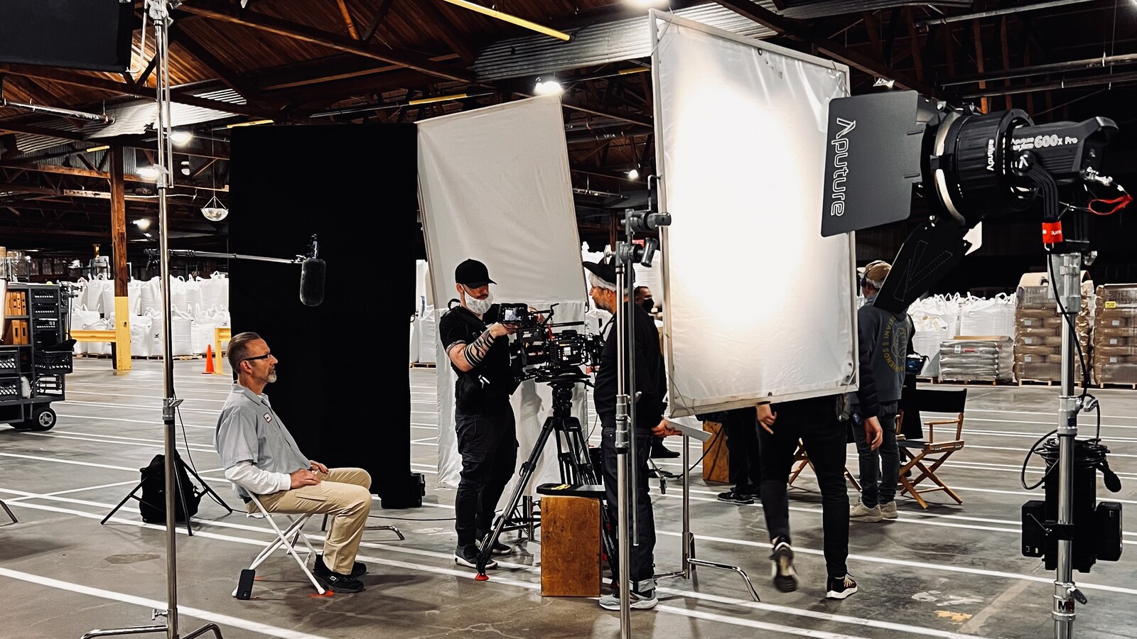 Interview build inside a warehouse, crew and lighting